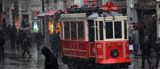 Snow falls as people walk on Istiklal avenue in Istanbul, on January 7, 2013. Heavy snowfall blanketed Turkey's commercial hub Istanbul, a city of 15 million, paralysing daily life, disrupting air traffic and land transport. Officials said the snow is expected to continue until late tomorrow, according to the weather forecast. AFP PHOTO / BULENT KILIC (Photo credit should read BULENT KILIC/AFP/Getty Images)