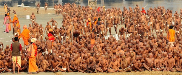 Newly initiated 'Naga Sadhus' sit as they perform rituals on the bank of the Ganga River during the Maha Kumbh festival in Allahabad on January 30, 2013. During every Kumbh Mela, the diksha - ritual of initiation by a guru - program for new members takes place. AFP PHOTO/ Sanjay KANOJIA (Photo credit should read Sanjay Kanojia/AFP/Getty Images)