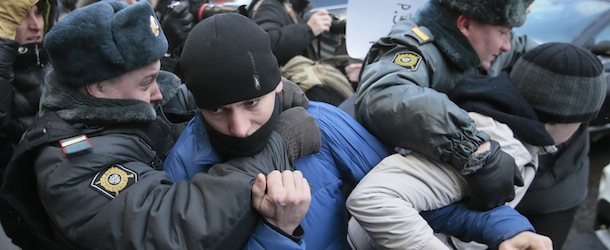 Police detain supporters of a bill banning "homosexual propaganda" near the State Duma, Russia's lower parliament chamber, in Moscow, Russia, Friday, Jan. 25, 2013. A controversial bill banning "homosexual propaganda" has been submitted to Russia's lower house of parliament for the first of three hearings on Friday. Twenty people were detained according to a police report. (AP Photo/Mikhail Metzel)