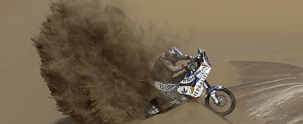 KTM rider Jorge Aguilar of Salvador tries to get out of a dune during the 6th stage of the 2013 Dakar Rally from Arica to Calama, Chile, Thursday, Jan. 10, 2013. The race finishes in Santiago, Chile, on Jan. 20. (AP Photo/Victor R. Caivano)