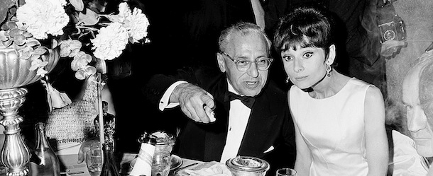 Movie director George Cukor points as actress Audrey Hepburn looks during dinner at the 1964 annual Academy Awards at the Santa Monica Civic Auditorium, Ca., on April 5, 1965. Cukor won an Oscar for best director for "My Fair Lady. (AP Photo)