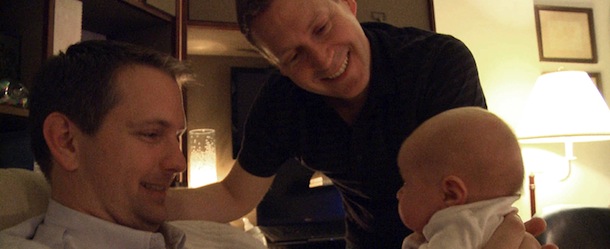 This undated image from video released by Logo shows adoptive gay parents Mark Krieger, left, and Paul Siebold in a scene with their baby girl from "The Baby Wait." "The Baby Wait" is a six-part documentary series on the Logo channel that focuses equal attention on agonizing post-birth waiting periods from the perspectives of both biological and adoptive parents. (AP Photo/Logo)