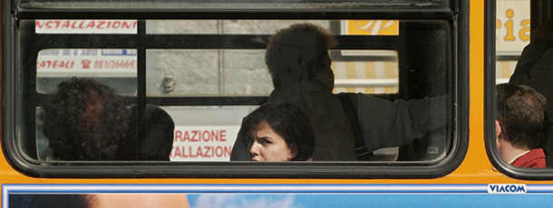 Naples, ITALY: A poster of Prime Minister Silvio Berlusconi's right-wing coalition is sticked on a bus, in Naples 30 March 2006, 10 days before the Italian general elections. The last opinion polls (27 March 2006) before Italy's April elections predicted victory for Romano Prodi's leftist alliance over Berlusconi's alliance, but many voters remained undecided. AFP PHOTO / MARIO LAPORTA (Photo credit should read MARIO LAPORTA/AFP/Getty Images)