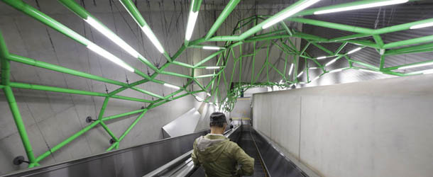 A man goes down to a subway platform by escalator in Tokyo, Wednesday, Oct. 24, 2012. (AP Photo/Shizuo Kambayashi)