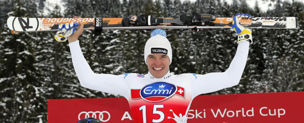 Italy's Christof Innerhofer celebrates with his team members after winning an Alpine Ski World Cup men's downhill, in Wengen, Switzerland, Saturday, Jan. 19, 2013. (AP Photo/Shinichiro Tanaka)