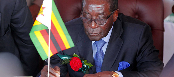 Zimbabwean President Robert Mugabe signs on May 29, 2012 in Victoria Falls the trilateral hosting agreement for the 2013 UNWTO General Assembly to be co-hosted by Zambia and Zimbabwe. 
AFP PHOTO / Joseph Mwenda (Photo credit should read Joseph Mwenda/AFP/GettyImages)