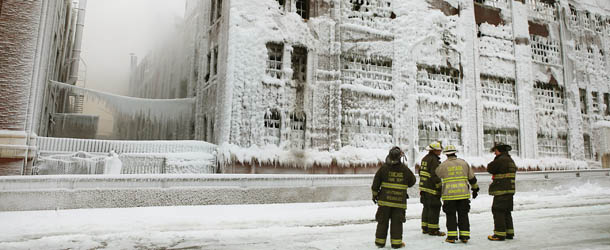 CHICAGO, IL - JANUARY 23: Firefighters work to extinguish a massive blaze at a vacant warehouse on January 23, 2013 in Chicago, Illinois. More than 200 firefighters battled a five-alarm fire as temperatures were in the single digits. (Photo by Scott Olson/Getty Images)