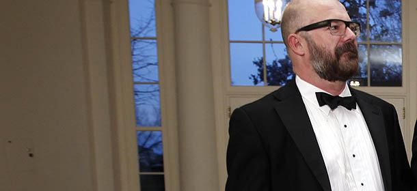 Andrew Sullivan of Newsweek/Daily Beast, left, and Aaron Tone arrive at the Booksellers area of the White House in Washington for the State Dinner hosted by President Barack Obama and first lady Michelle Obama for British Prime Minister David Cameron and his wife Samantha, Wednesday, March 14, 2012. (AP Photo/Charles Dharapak)