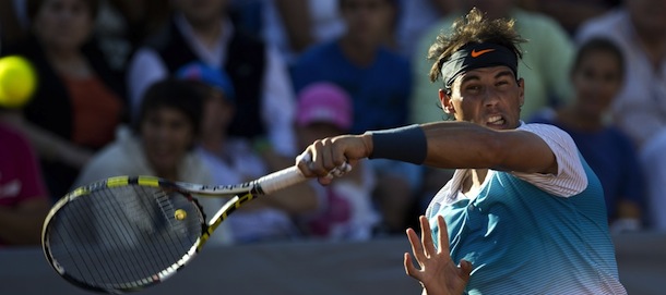 Spanish tennis player Rafael Nadal hits a return during an ATP Vina del Mar tournament doubles match with Argentine Juan Monaco (not in frame), against Czech Republic's Frantisek Cermank and Lukas Dlouhy, in Vina del Mar, about 120 km northwest of Santiago, on February 5 , 2013. AFP PHOTO/MARTIN BERNETTI (Photo credit should read MARTIN BERNETTI/AFP/Getty Images)