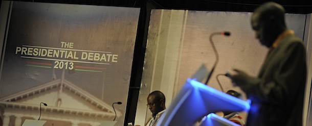 People stand behind pulpits during a presidential debate rehearsal on February 10, 2013 in the Kenyan capital Nairobi. Kenya's six presidential aspirants are expected to face-off in the country's first ever pre-election presidential debate amid fears of likely violence during the upcoming national elections. The risk of political violence in Kenya is "perilously high" ahead of next month's election, the first since bloody post-poll violence five years ago, Human Rights Watch (HRW) warned. AFP PHOTO / TONY KARUMBA (Photo credit should read TONY KARUMBA/AFP/Getty Images)