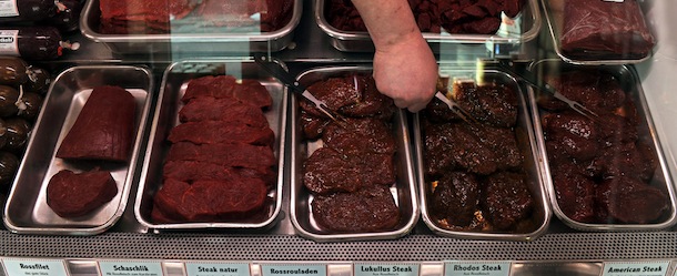 A butcher arranges different sorts of horse meat on sale at his shop in Bremen, northern Germany on February 14, 2013. The scandal over horsemeat-tainted food spiraled after Britain announced the discovery of a potentially harmful drug in horsemeat sent to France and Germany. AFP PHOTO / INGO WAGNER GERMANY OUT (Photo credit should read INGO WAGNER/AFP/Getty Images)