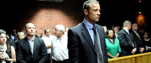 South African Olympic sprinter Oscar Pistorius (C) appears on February 19, 2013 at the Magistrate Court in Pretoria as he father Henke (3rd L), brother Carl (2nd L) and sister Aimee (L) attend. Pistorius battled to secure bail as he appeared on charges of murdering his model girlfriend Reeva Steenkamp on February 14, Valentine's Day. South African prosecutors will argue that Pistorius is guilty of premeditated murder in Steenkamp's death, a charge which could carry a life sentence. AFP PHOTO / STEPHANE DE SAKUTIN
 (Photo credit should read STEPHANE DE SAKUTIN/AFP/Getty Images)