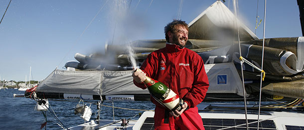 In this photo released by Telecom Italia, skipper Giovanni Soldini sprays champagne after arriving in Marblehead on the coast of Massachussetts, in the Artemis Transat Atlantic crossing, Wednesday May 28, 2008. In a release, Telecom Italia said Soldini sailed across the Atlantic in 16 days, 22 hours and 11 minutes. (AP Photo/Telecom Italia, HO) ** EDITORIAL USE ONLY **