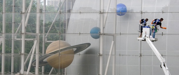 Window cleaners wash the Rose Center for Earth and Space at the American Museum of Natural History in New York, Thursday, June 17, 2010. This is the first time in its ten year history that the almost acre of glass has been washed. (AP Photo/Charles Sykes)