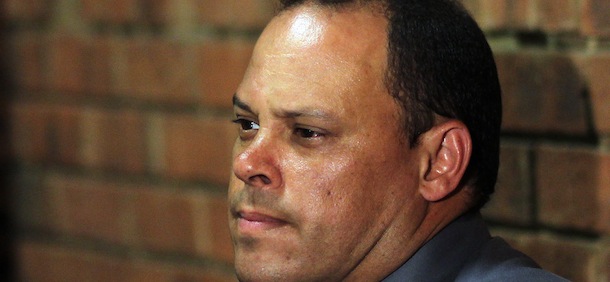 Investigating officer Hilton Botha, sits inside the court witness box during the Oscar Pistorius bail hearing at the magistrate court in Pretoria, South Africa, Wednesday, Feb. 20, 2013. Olympic athlete Pistorius is charged with premeditated murder for the Feb. 14 shooting death of his girlfriend, Reeva Steenkamp. The bail hearing continues. (AP Photo/Themba Hadebe)