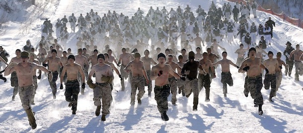 Half-naked South Korean and U.S. Marines from 3-Marine Expeditionary Force 1st Battalion from Kaneho Bay, Hawaii, run on a snow field during their joint military winter exercise in Pyeongchang, east of Seoul, South Korea, Thursday, Feb. 7, 2013.
More than 400 Marines participated in the joint winter exercise which began on Feb. 4 until Feb. 22 and it is the first time that both countries' Marine Corps have held joint winter military drills in the nation. (AP Photo/Lee Jin-man)