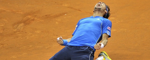 Italy's Fabio Fognini celebrates after defeating Croatia's Ivan Didig during the fifth single match of the tennis Davis Cup World Group first round between Italy and Croatia, in Turin, Italy, Sunday, Feb. 3, 2013. Fognini with a 4-6, 6-4, 6-4, 6-4 victory allowed Italy to defeat Croatia 3-2 and advance to the quarterfinals for the first time since 1998, when it won the competition (AP Photo/Massimo Pinca)