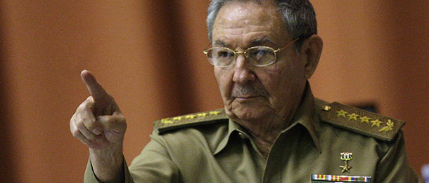 Cuba's President Raul Castro points as he attends a session of the National Assembly in Havana, Cuba, Thursday, Dec. 13, 2012. The session is one of the National Assembly's twice-yearly gatherings. (AP Photo/Ismael Francisco, Cubadebate)