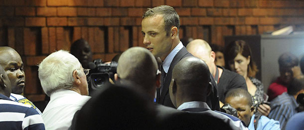 South African athlete Oscar Pistorius at the end of court proceedings, in Pretoria, South Africa, Friday, Feb 15, 2013. Pistorius was formally charged at Pretoria Magistrate's Court with one count of murder after his girlfriend, Reeva Steenkamp, a model and budding reality TV show participant, was shot multiple times and killed at Pistorius' upmarket home in the predawn hours of Thursday. (AP Photo/Antione de Ras - Independent Newspapers Ltd South Africa-Star) SOUTH AFRICA OUT