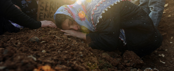 Women mourn for victims of a Turkish air raid, at the cemetery of Gulyazi Village, Sirnak province, near the Iraqi border, on December 30, 2011. Thousands of irate Kurds today buried 35 civilians killed in a Turkish air raid and branded Prime Minister Recep Tayyip Erdogan a murderer. The weeping mourners accompanied the coffins of victims of the strike of December 29 to the cemetery in Gulyazi village, near the Iraqi border, from the nearby town of Uludere where a service was held at the mosque. AFP PHOTO / BULENT KILIC (Photo credit should read BULENT KILIC/AFP/Getty Images)