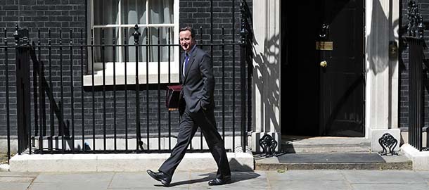 British Prime Minister David Cameron leaves 10 Downing Street in London on June 2, 2010, as he heads for the House of Commons to address his first Prime Ministers Questions debate as Prime Minister. Cameron said he was "alarmed and shocked" by the shootings of at least five people at the start of his first weekly grilling in the House of Commons after winning elections last month. "At least five people have died," he said, adding: "The government will do everything it possibly can to help the local community and those affected." AFP PHOTO/Carl Court (Photo credit should read Carl Court/AFP/Getty Images)