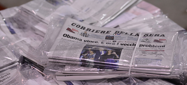 The November 8, 2012 edition of the Italian newspaper ?Corriere della Sera? with its frontpage on the results of the US election is ready to be delivered late on November 7, 2012 at the printing house of the newspaper in Milan. Italian Foreign Minister Giulio Terzi the same day said that US President Barack Obama's re-election makes America "stronger" and more ready to engage on major issues like the eurozone debt crisis. (Photo credit should read GIUSEPPE CACACE/AFP/Getty Images)