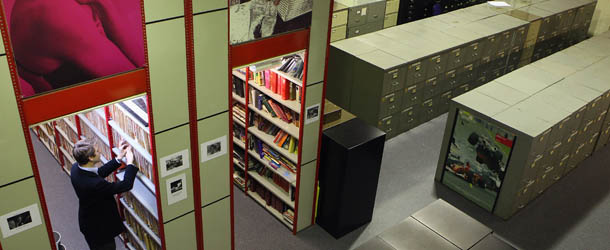 LONDON, ENGLAND - MAY 12: A man looks through the vast collection of historic photographs in the Hulton Archive on May 12, 2011 in London, England. The comprehensive archive contains pictures created at the birth of photography in the early 1800s and covers every era and event through to the 21st century. Staff at the Hulton Archive are employed on a wide range of jobs including: conservation, retouching, hand-printing, scanning and archiving. (Photo by Oli Scarff/Getty Images)