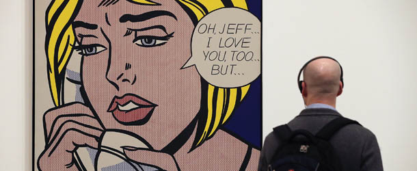 LONDON, ENGLAND - FEBRUARY 18: A visitor looks at a painting entitled 'Oh, Jeff... I Love You, Too...But... ' during a press preview of 'Lichtenstein, a Retrospective' at the Tate Modern on February 18, 2013 in London, England. The painting is part of a retrospective exhibition by 1960's Pop Artist Roy Lichtenstein, the first of its kind in 20 years, which runs at the gallery until May 27, 2013. (Photo by Dan Kitwood/Getty Images)