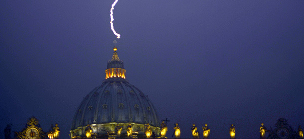 VATICAN CITY - FEBRUARY 11: Lightning strikes St Peter's dome at the Vatican on February 11, 2013. Pope Benedict XVI announced today he will resign as leader of the world's 1.1 billion Catholics on February 28 because his age prevented him from carrying out his duties -- an unprecedented move in the modern history of the Catholic Church. (Photo by FILIPPO MONTEFORTE/AFP/Getty Images)