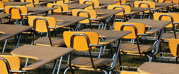 WASHINGTON, DC - JUNE 20: An installation of 857 empty school desks, representing the number of students nationwide who are dropping out every hour of every school day, is on display at the National Mall June 20, 2012 in Washington, DC. The installation was presented by not-for-profit organization College Board to call upon presidential candidates who are running for the White House to make education a more prominent issue in the 2012 campaigns and put the nationâs schools back on track. (Photo by Alex Wong/Getty Images)