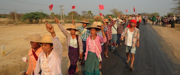 Myanmar villagers shout slogans as they protest against a Chinese-backed copper mine project, in Monywa northern Myanmar on March 13, 2013. Myanmar opposition leader Aung San Suu Kyi urged protesters on March 13 to accept a controversial Chinese-backed mine that was the scene of a violent crackdown last year, or risk hurting the economy. AFP PHOTO/ Soe Than WIN (Photo credit should read Soe Than WIN/AFP/Getty Images)