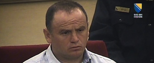 In this screen grab taken from video, provided by the Court of Bosnia and Herzegovina, Veselin Vlahovic, during his sentencing in court, in Sarajevo, Bosnia and Herzegovina, Friday, March 29, 2013. A court in Bosnia on Friday convicted a Montenegrin man of multiple counts of murder, torture, rape and looting during Bosnia's 1992-95 war, and sentenced him to 45 years in prison Ã³ the highest sentence ever issued in the country. Judge Zoran Bozic said that Veselin Vlahovic, killed 31 people, raped a number of Bosniak and Croat women and tortured and robbed non-Serb residents of a Sarajevo suburb while fighting for the Bosnian Serbs. Among other crimes, the judge described how Vlahovic cut the throats of two brothers in front of their mother, then killed her and raped the men's wives. (AP Photo /Court of Bosnia and Herzegovina)