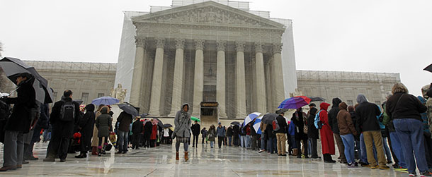 People wait to enter, outside of the U.S. Supreme Court, in Washington, on Monday March, 25, 2013, a day before the case for gay and lesbian couples rights, will be argued before the Supreme Court. (AP Photo/Jose Luis Magana)