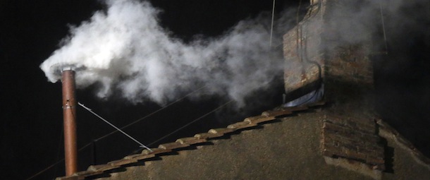 White smoke emerges from the chimney on the roof of the Sistine Chapel, in St. Peter's Square at the Vatican, Wednesday, March 13, 2013. The white smoke indicates that the new pope has been elected. (AP Photo/Gregorio Borgia)