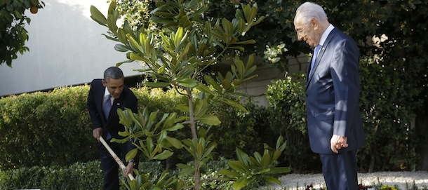 Israeli President Shimon Peres watches at right as President Barack Obama plants a magnolia tree during a planting ceremony at the Presidentâs Residence in Jerusalem, Israel, Wednesday, March 20, 2013. Obama help plant a magnolia tree which is a descendant of an original magnolia tree from the White House grounds. (AP Photo/Pablo Martinez Monsivais)