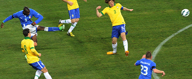 GENEVA, SWITZERLAND - MARCH 21: Mario Balotelli (L) of Italy scores his teams second goal i during the international friendly match between Italy and Brazil on March 21, 2013 in Geneva, Switzerland. (Photo by Dino Panato/Getty Images)