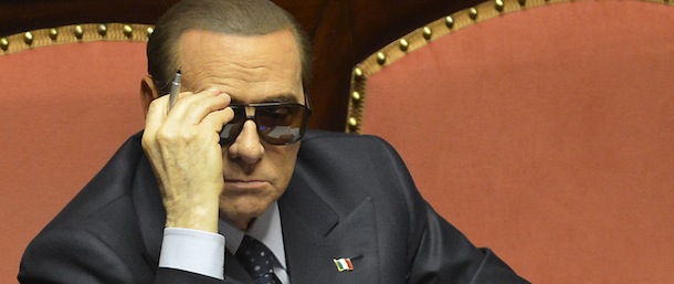 Italy's billionaire former prime minister Silvio Berlusconi, wearing sunglasses, is pictured at the Senate on March 16, 2013 in Rome. Judges in Milan decided to postpone to Monday a hearing in Silvio Berlusconi's trial for having sex with an underage prostitute because of the former prime minister's health issues.The court had sent in medical experts to work out whether or not Berlusconi was exaggerating an apparent eye infection and hypertension in order to delay a trial in which the verdict is looming. AFP PHOTO / ALBERTO LINGRIA (Photo credit should read ALBERTO LINGRIA/AFP/Getty Images)