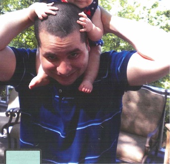 This undated photo submitted into evidence by defense attorney Julia L. Gatto shows New York City police Officer Gilberto Valle with his daughter. A jury is beginning its first full day of deliberations, Friday, March 8, 2013, in the case against Valle, who is accused of conspiring to kidnap, kill and cannibalize as many as six women that he knew, including his wife. If convicted, he could face life in prison. (AP Photo/Provided by Attorney Julia L. Gatto)