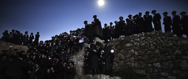 Ultra-Orthodox Jews collect water from a mountain spring near Jerusalem on March 24, 2013 to be used in baking the unleavened bread, known as matzoth, during the Maim Shelanu (Rested Water) ceremony. Religious Jews throughout the world eat matzoth during the eight-day Pesach holiday (Passover), which begins on March 25, with the sunset to commemorate the Israelis' exodus from Egypt some 3,500 years ago and commemorate their ancestors' plight by refraining from eating leavened food products. AFP PHOTO/MENAHEM KAHANA (Photo credit should read MENAHEM KAHANA/AFP/Getty Images)