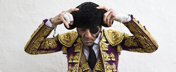 Spanish bullfighter Juan Jose Padilla adjust his 'montera' of bullfighter's hat before the first bullfight of the season in the southwestern Spanish town of Olivenza, Spain, on Saturday, March 2, 2013. Bullfighting is an ancient tradition in Spain and the season runs from March to October. (AP Photo/Daniel Ochoa de Olza)