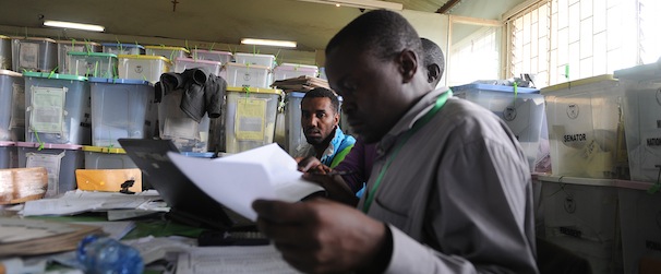 Kenyan Independent Electoral and Boundaries Commission (IEBC) officials finalise ballot-counting at a polling station on March 6, 2013 in the Mathare slum, in Nairobi. Kenyans awaited presidential results with growing frustration at controversial delays and mountains of spoiled ballots, five years after violence sparked by a disputed tallying process. AFP PHOTO / SIMON MAINA (Photo credit should read SIMON MAINA/AFP/Getty Images)