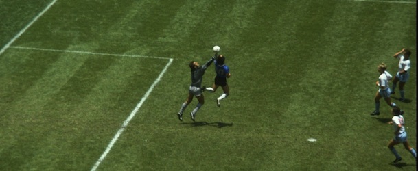 22 Jun 1986: Diego Maradona of Argentina handles the ball past Peter Shilton of England to score the opening goal of the World Cup Quarter Final at the Azteca Stadium in Mexico City, Mexico. Argentina won 2-1. Mandatory Credit: Allsport UK /Allsport