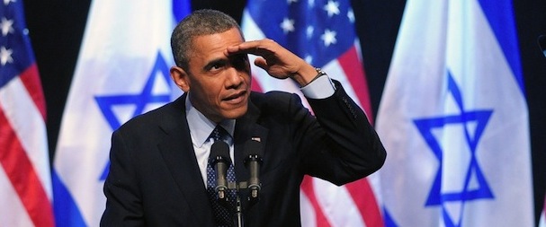 US President Barack Obama shields his eyes as he looks up at a person who shouted out during his speech to the Israeli people at the Jerusalem International Convention Center in Jerusalem, on March 21, 2013 on the second day of his 3-day trip to Israel and the Palestinian territories. AFP PHOTO/Mandel NGAN (Photo credit should read MANDEL NGAN/AFP/Getty Images)