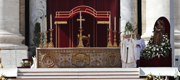 Pope Francis blesses the faithful in St. Peter's Square during his inauguration Mass at the Vatican, Tuesday, March 19, 2013. (AP Photo/Michael Sohn)