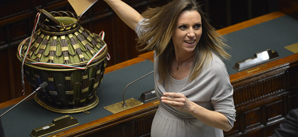 Former fencing champion and newly elected member of parliament for the centrist coalition Valentina Vezzali casts her ballot during the first session of Italian lower-house on March 15, 2013 in Rome. General election in Italy took place on February 26 but as a majority in both chambers of parliament is required to form a government, Italy is left in a state of limbo with a hung parliament that is unprecedented in its post-war history. AFP PHOTO / ANDREAS SOLARO (Photo credit should read ANDREAS SOLARO,ANDREAS SOLARO/AFP/Getty Images)