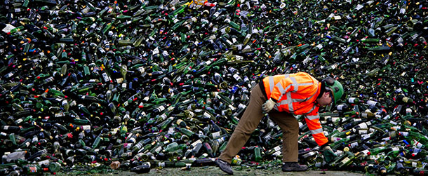 An employee of the Maltha glass recycling proccesses an enormous amount of bottles which arrived after the Christmas holidays in Heijningen on January 2, 2012. Trucks drive on and off to deliver the contents of the overflowing bottle banks across the land. AFP PHOTO / ANP / ROBIN UTRECHT ***NETHERLANDS OUT - BELGIUM OUT*** (Photo credit should read ROBIN UTRECHT/AFP/Getty Images)
