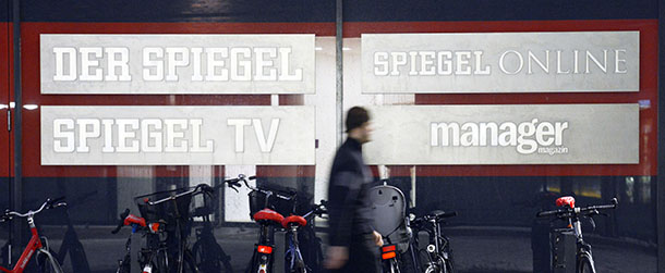 HAMBURG, GERMANY - DECEMBER 07: A man walks past the signs of the different divisions of the editorial offices of German news weekly Der Spiegel on December 7, 2012 in Hamburg, Germany. Spiegel Verlag, the publishing company that owns Der Spiegel, as well the Spiegel Online, which is the Internet edition of the magazine, and Spiegel TV, announced recently the company must face declining circulation with cost reduction, which will include layoffs. Of the 150 employees at Spiegel TV 40 have already been laid off. The German media landscape is currently weathering a series of setbacks that include the recent closings of the Frankfurter Rundschau and Financial Times Deutschland daily newspapers as well as the bankruptcy declaration of the dapd news agency. (Photo by Patrick Lux/Getty Images)