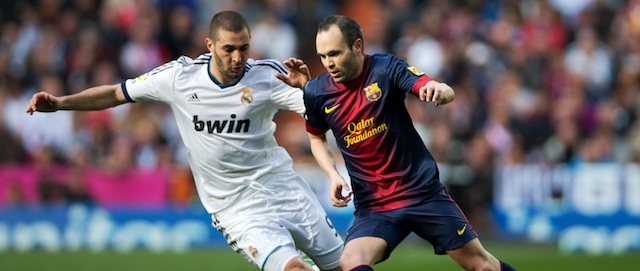 MADRID, SPAIN - MARCH 02: Andres Iniesta (R) of Barcelona duels for the ball with Karim Benzema of Real Madrid during the la Liga match between Real Madrid CF and FC Barcelona at Estadio Santiago Bernabeu on March 2, 2013 in Madrid, Spain. (Photo by Jasper Juinen/Getty Images)