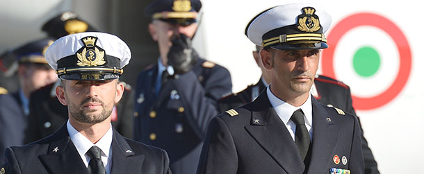(FILES) This file picture taken on December 22, 2012 shows Italian marines Massimiliano Latorre (R) and Salvatore Girone (L) arriving at Ciampino airport near Rome. The Italian foreign ministry on March 11, 2013 said the two Italian marines accused of killing two Indian fishermen they mistook for pirates would not return to India when their court-allowed leave runs out at the end of this month. AFP PHOTO / FILES / VINCENZO PINTO (Photo credit should read VINCENZO PINTO/AFP/Getty Images)
