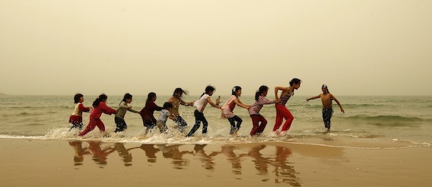 Palestinian children play on the beach in Gaza City during a dust storm on April 1, 2013. AFP PHOTO/MOHAMMED ABED (Photo credit should read MOHAMMED ABED/AFP/Getty Images)